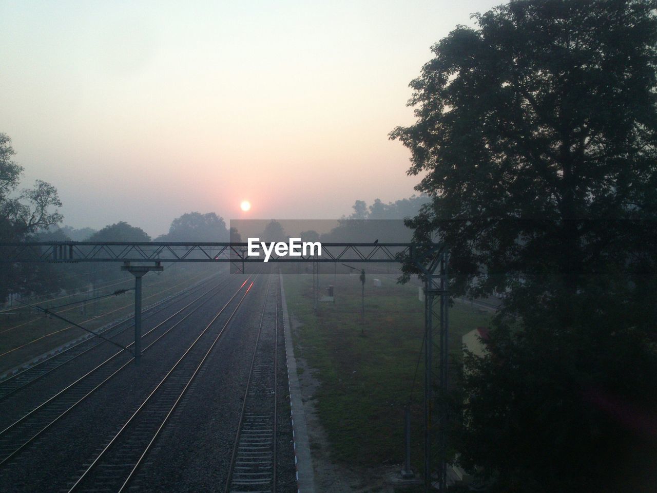High angle view of railroad tracks against sky during sunrise