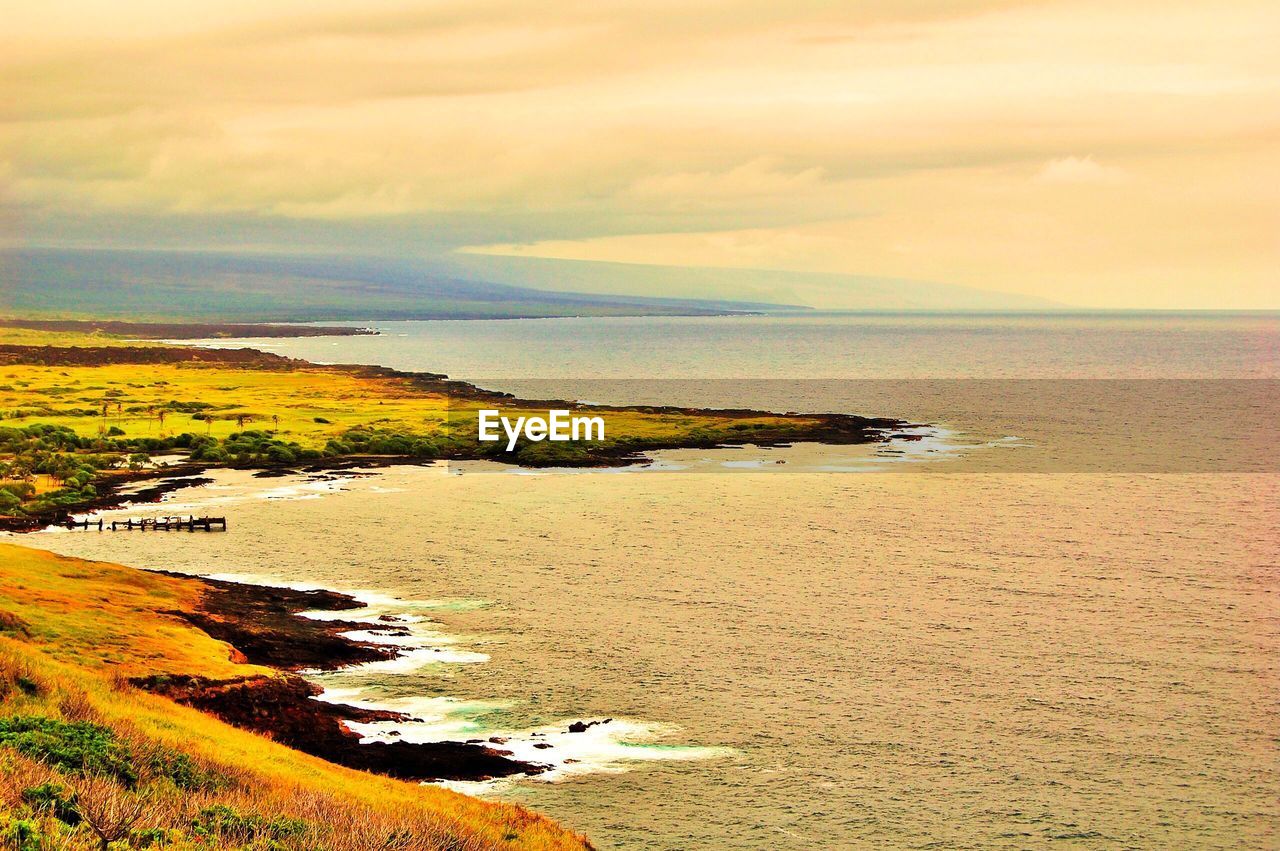 Scenic view of sea against sky at sunset