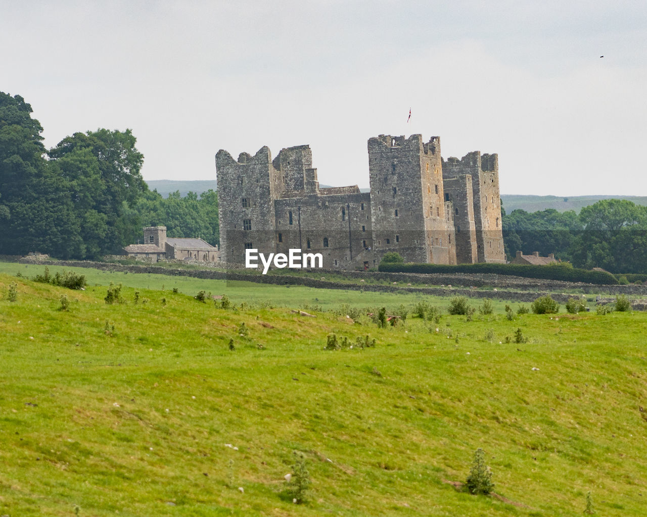 Castle on landscape against sky