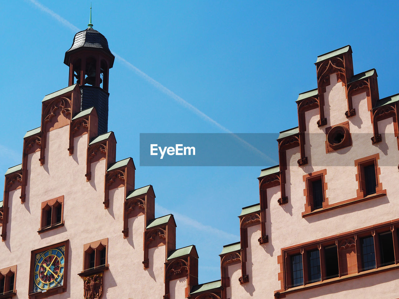 Low angle view of old building against blue sky