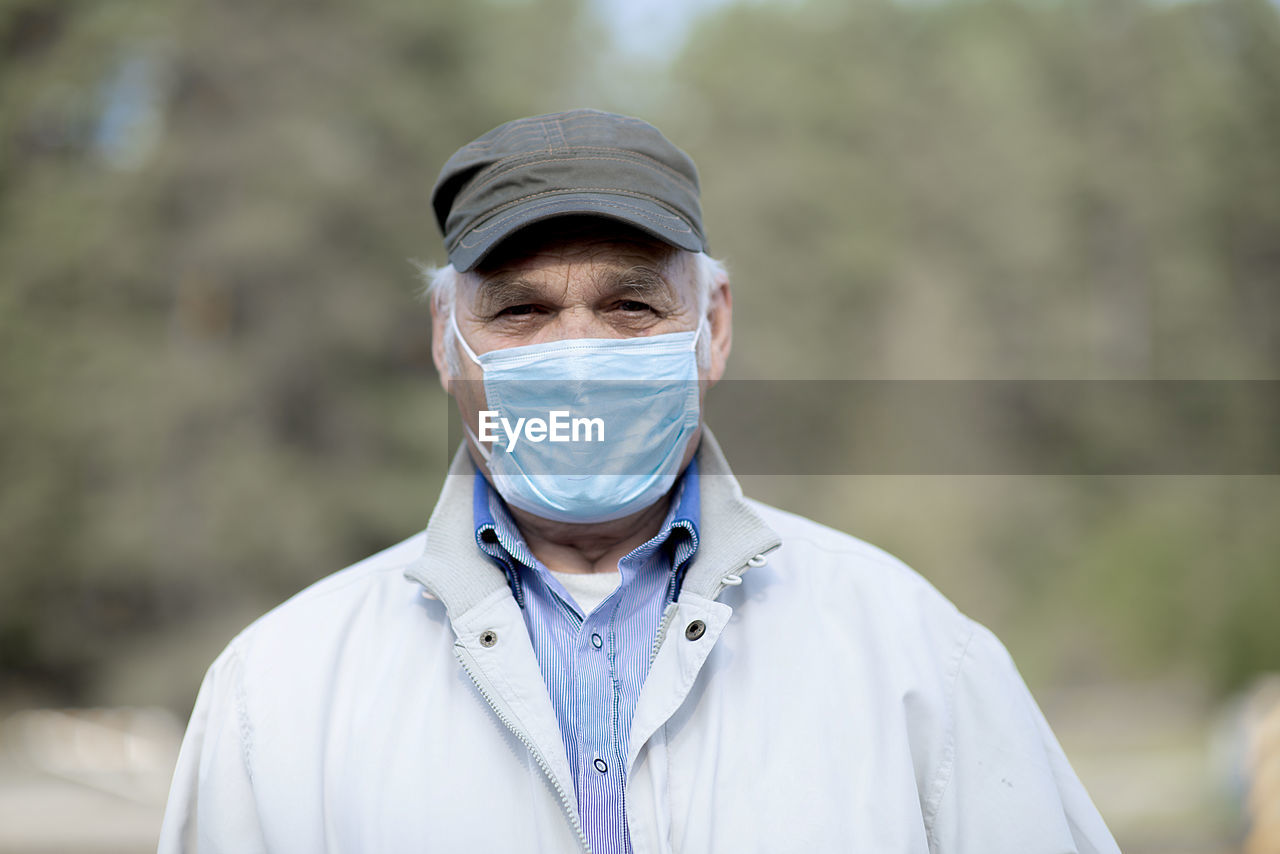 Portrait of  old man wearing a medical mask. a concept of the danger of coronavirus for the elderly.