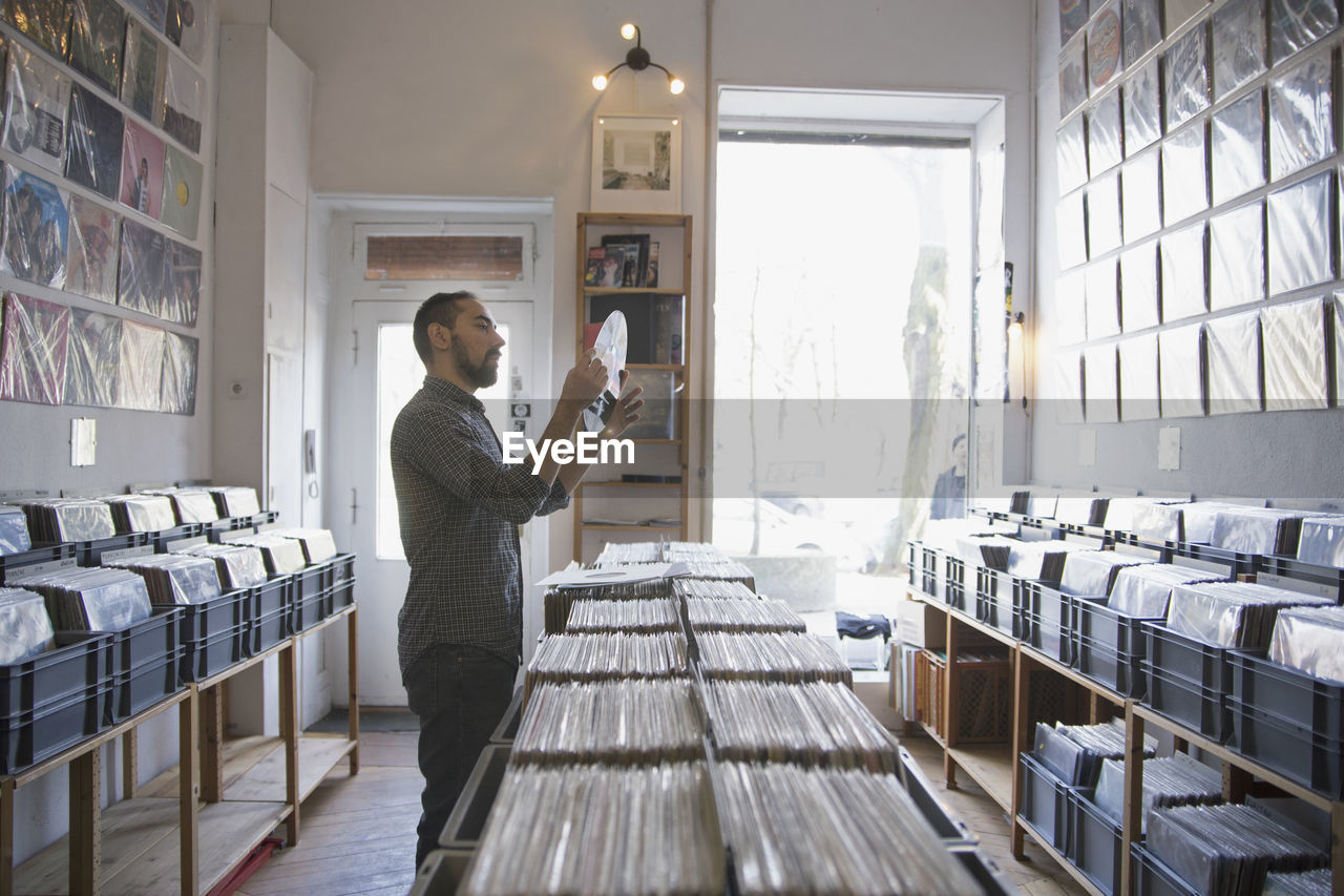 Young man shopping for records