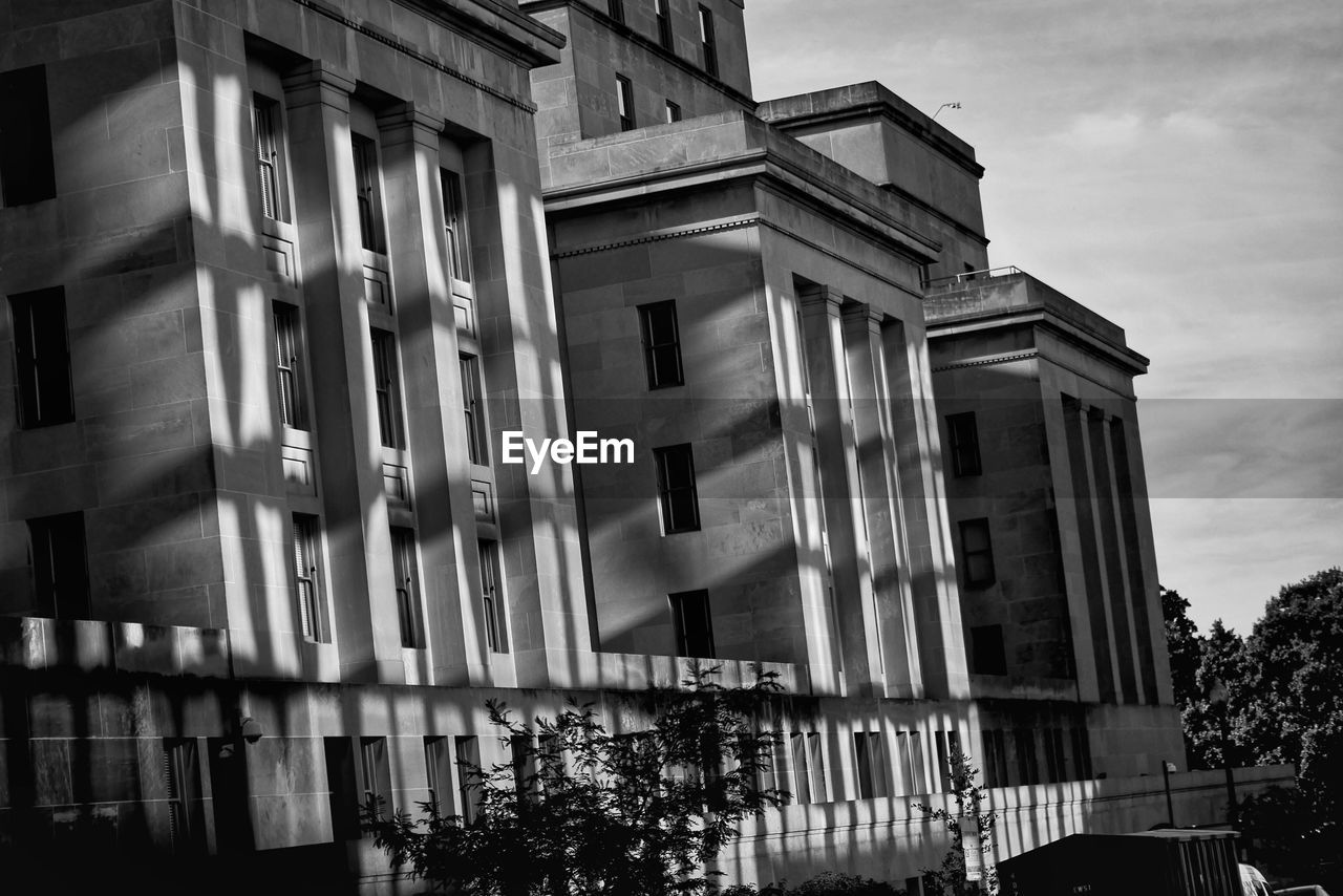 LOW ANGLE VIEW OF BUILDING WITH WINDOWS