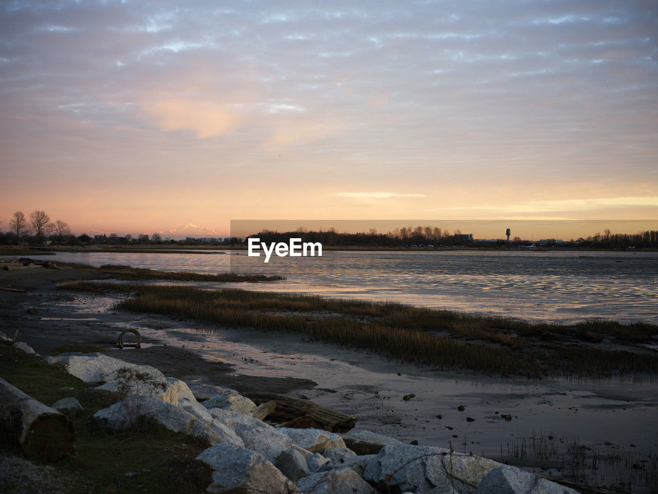 sky, water, sunset, sea, shore, wave, land, dawn, reflection, nature, cloud, environment, scenics - nature, ocean, beauty in nature, landscape, beach, horizon, coast, evening, tranquility, sunlight, sun, no people, body of water, wind wave, architecture, outdoors, tranquil scene, travel destinations, travel, rock, dramatic sky, snow, low tide