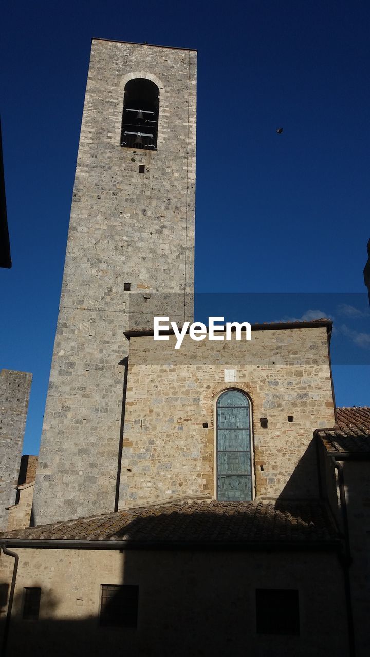 LOW ANGLE VIEW OF BELL TOWER AGAINST CLEAR SKY