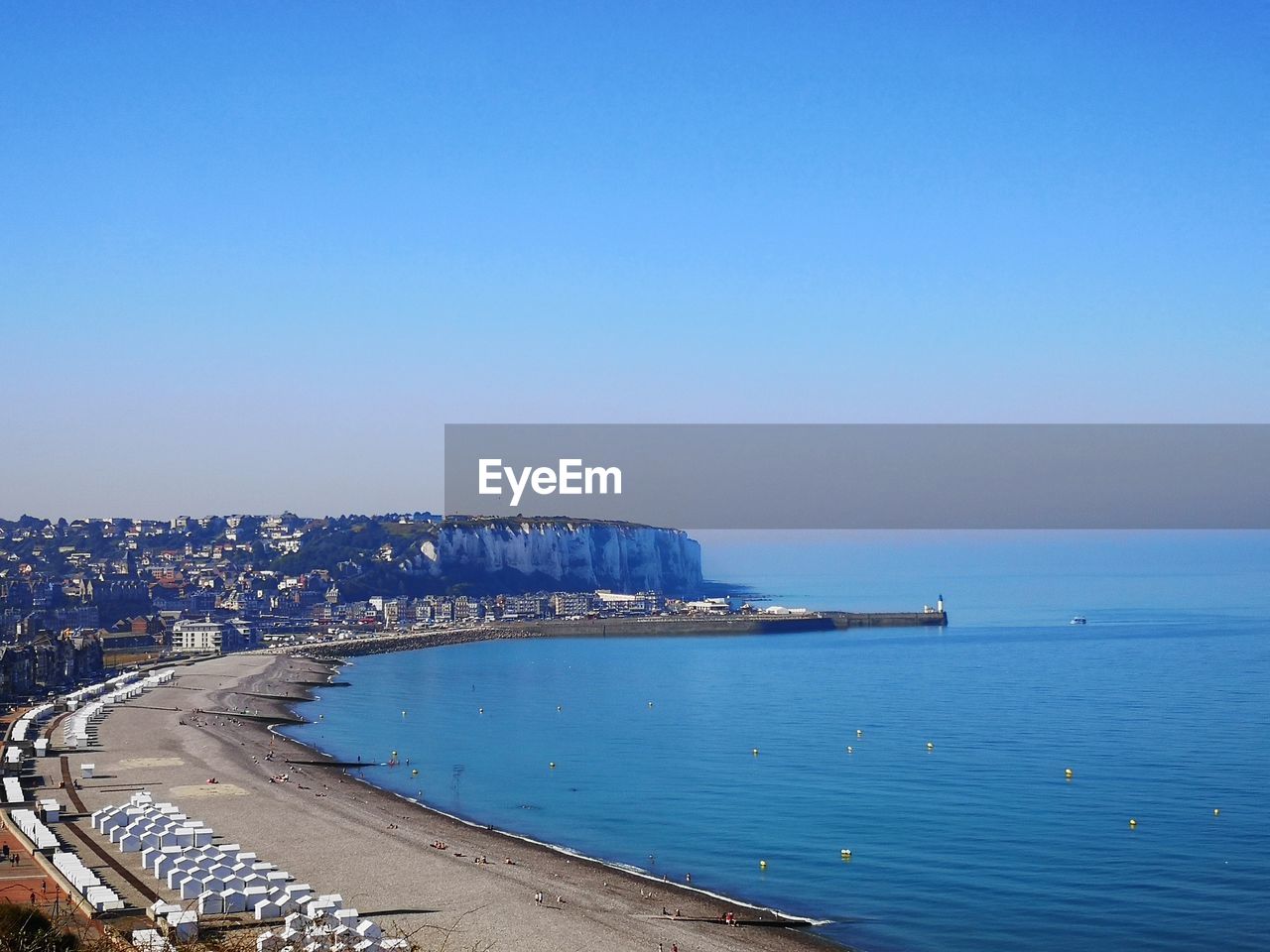 Scenic view of sea against clear blue sky