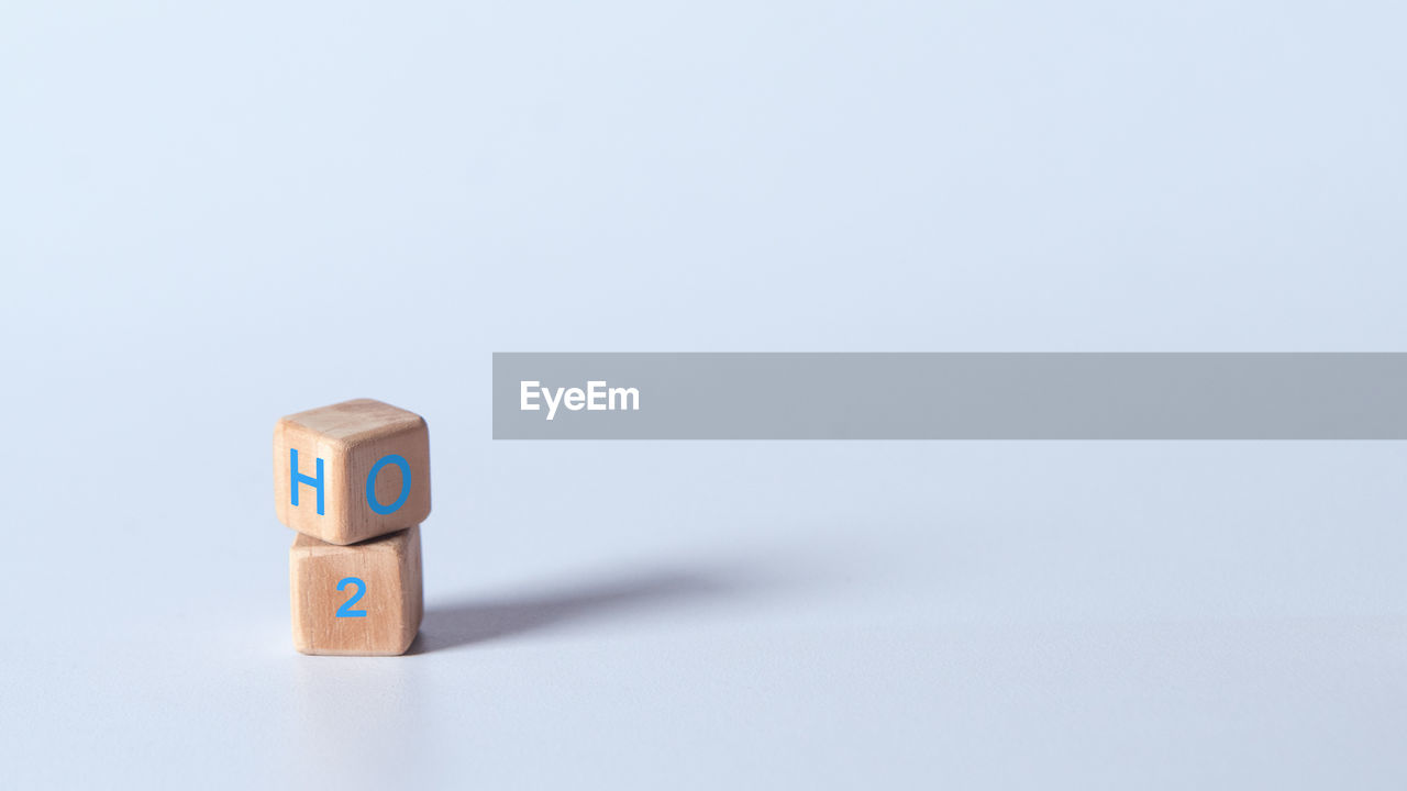 copy space, studio shot, indoors, no people, toy, toy block, white background, indoor games and sports, tabletop game, single object, still life, blue