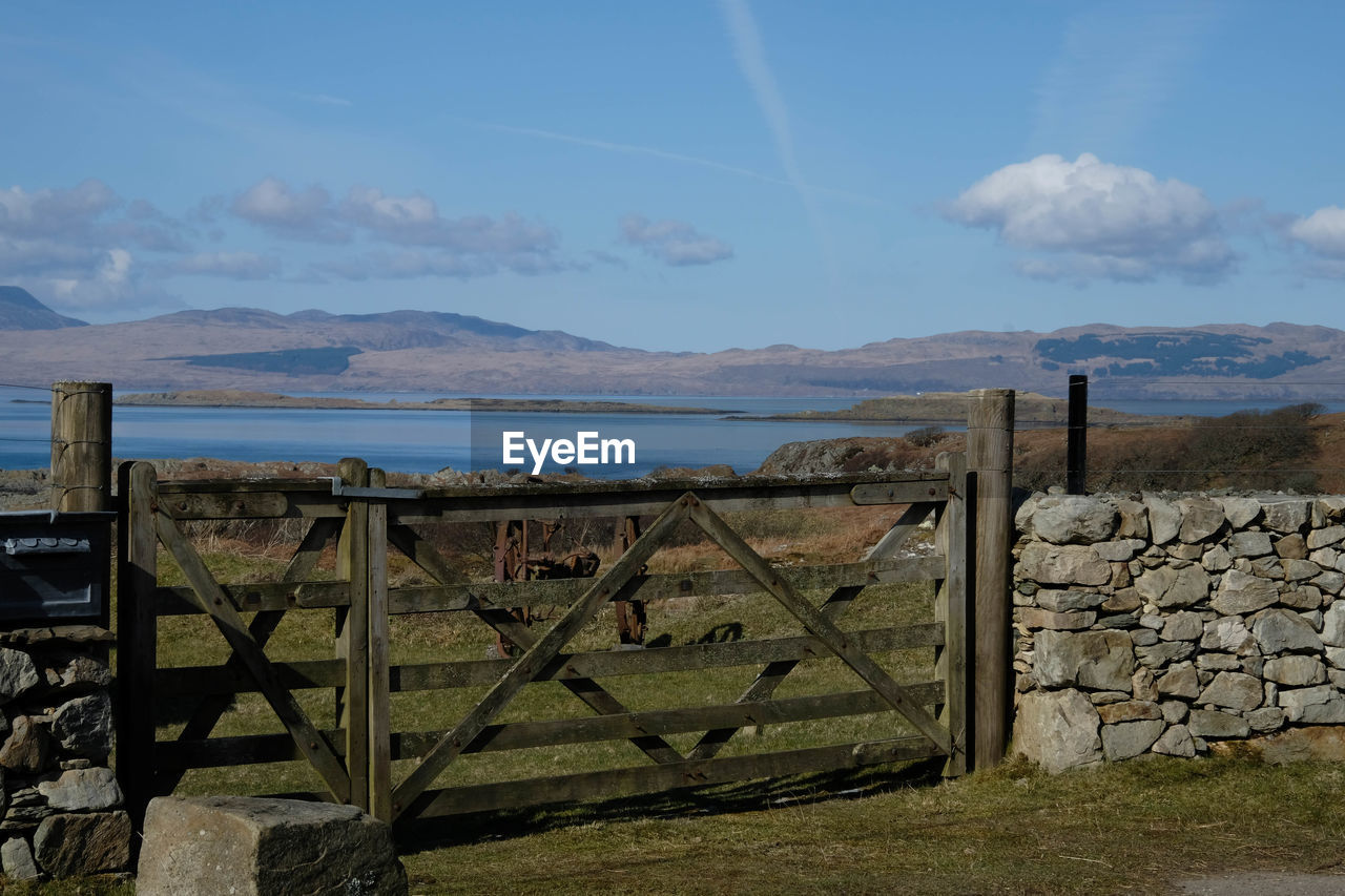 View across loch over a gate