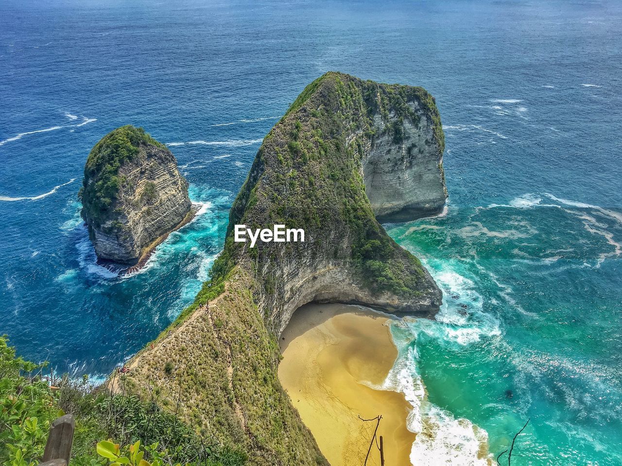 High angle view of rocks by seashore