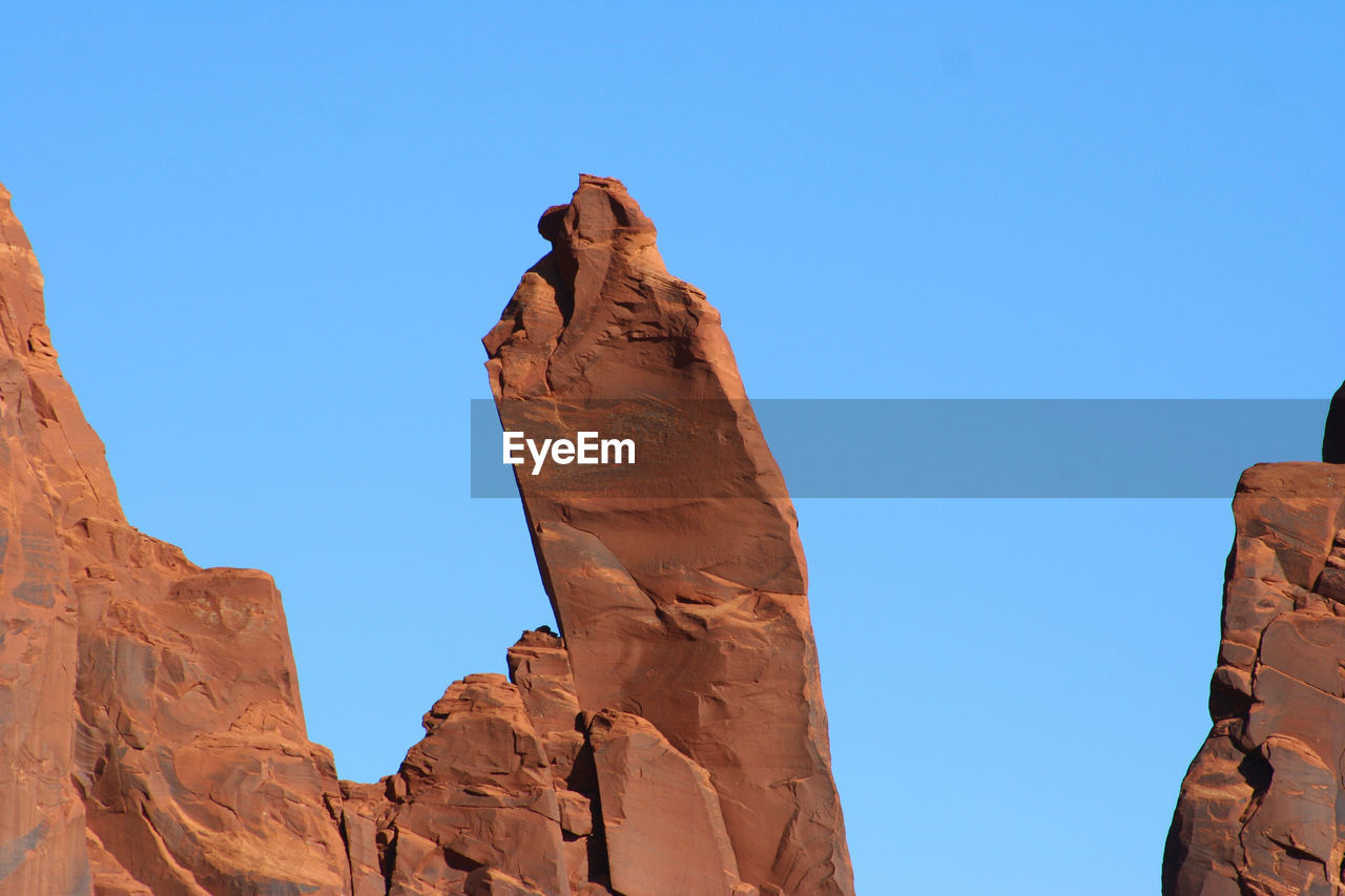 LOW ANGLE VIEW OF ROCK FORMATIONS