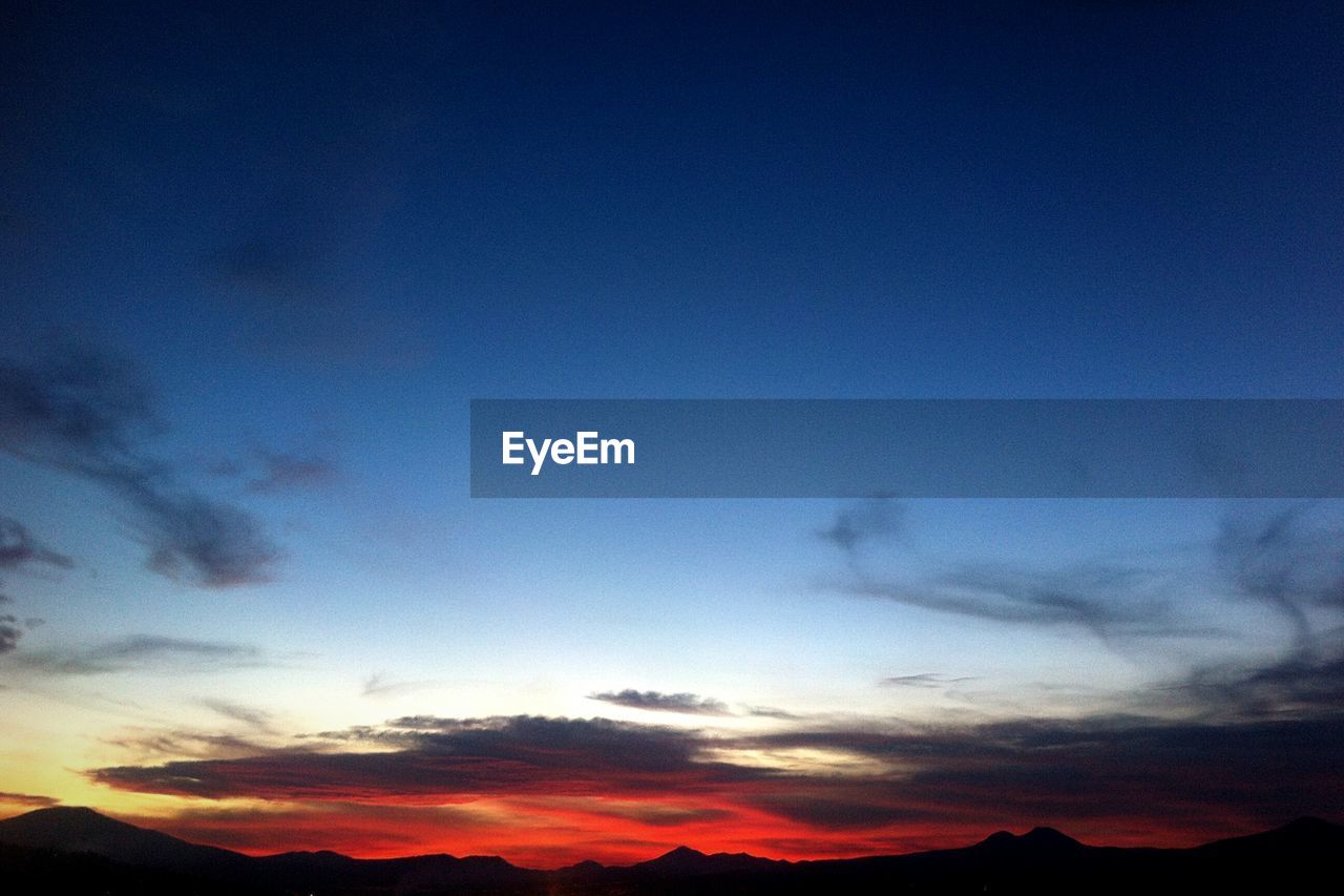 SCENIC VIEW OF BLUE SKY DURING SUNSET