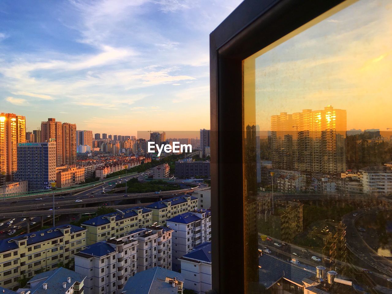 High angle view of cityscape against sky at sunset