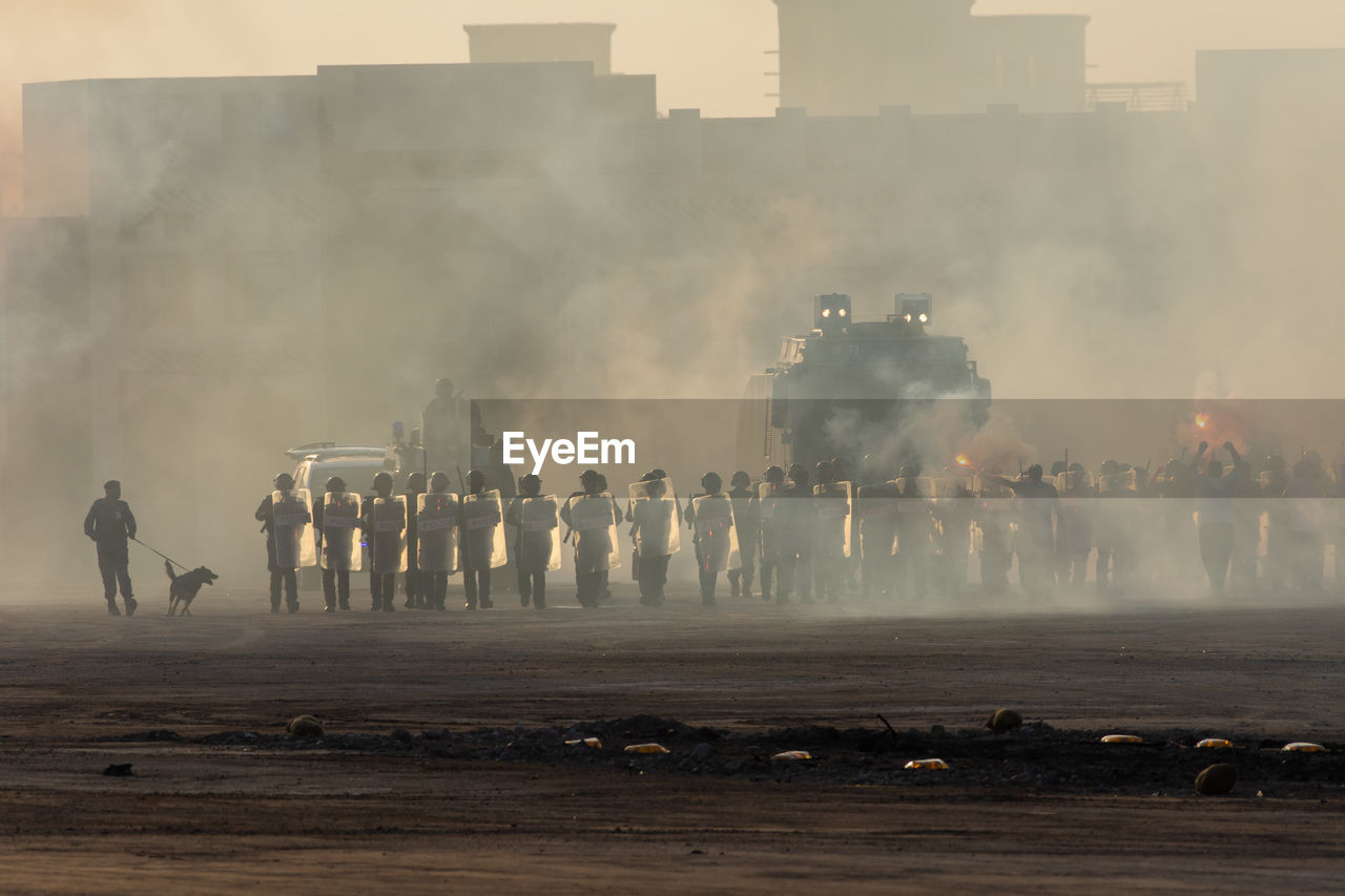 GROUP OF PEOPLE IN FRONT OF BUILDING