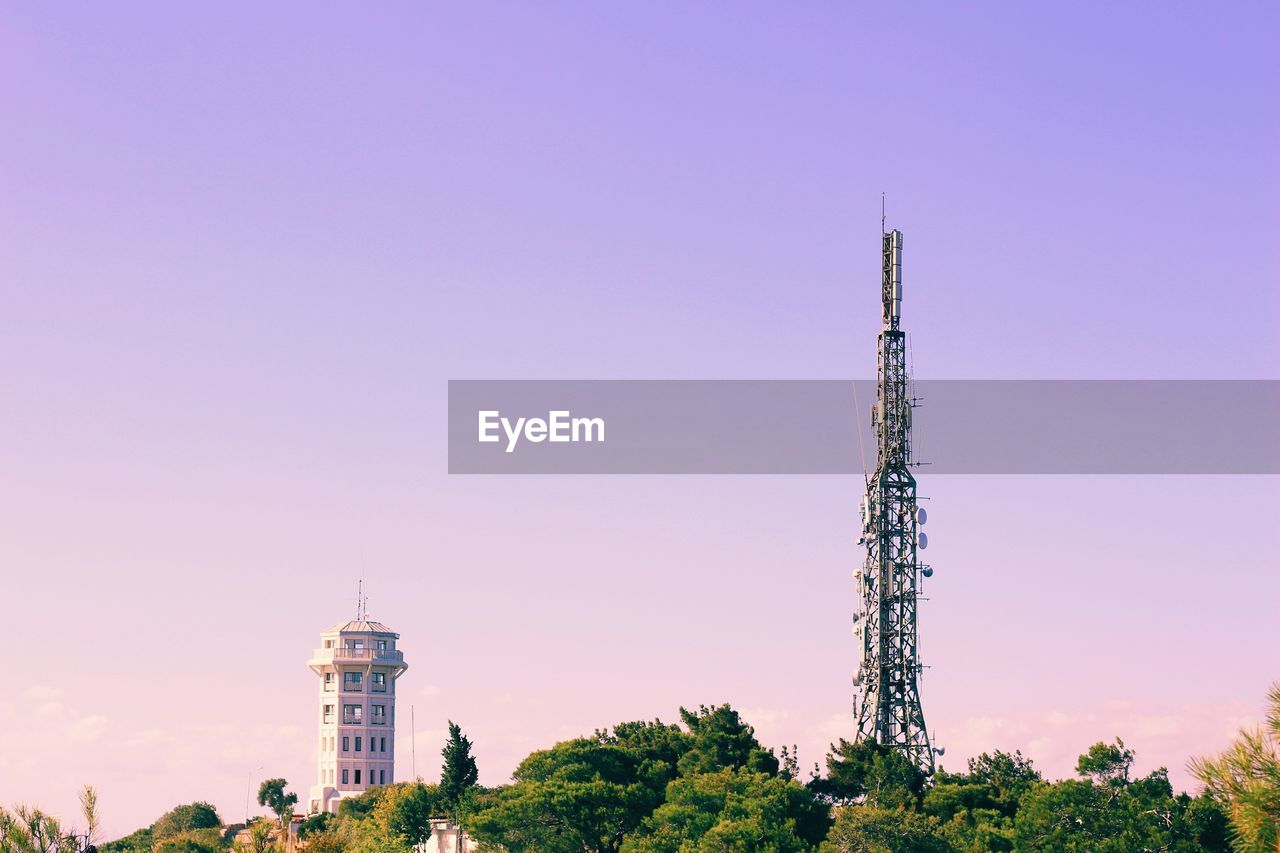 Low angle view of communications tower against sky