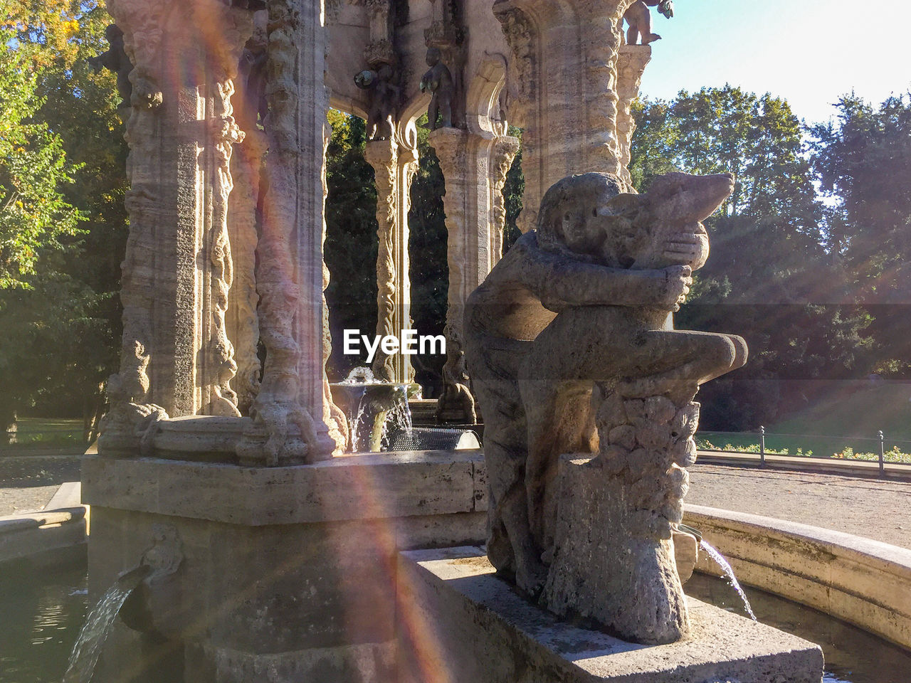 LARGE GROUP OF STATUE ON TREE