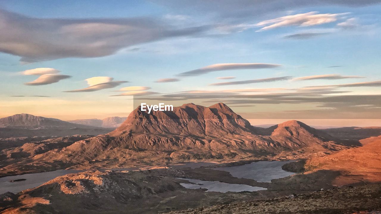 Scenic view of mountains against sky during sunset