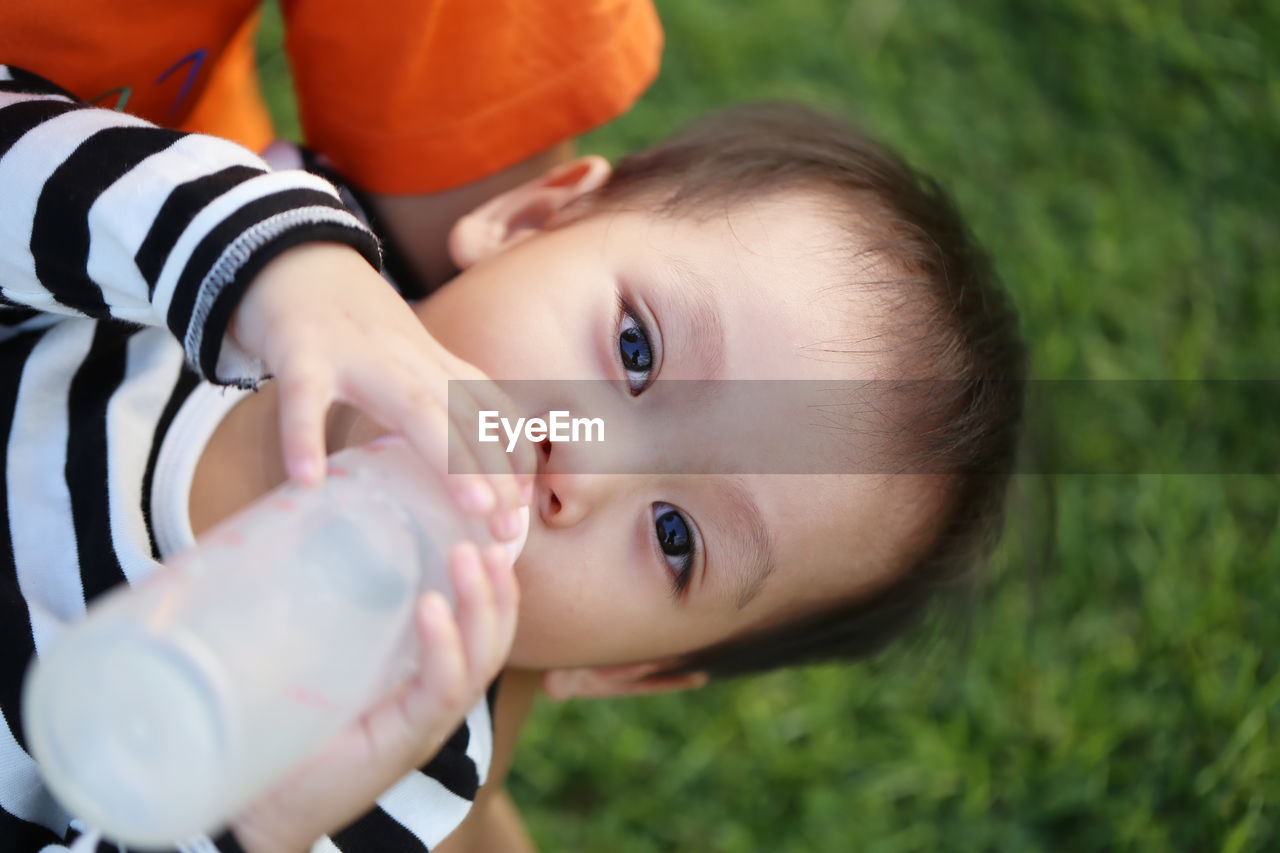 Portrait of cute boy drinking milk