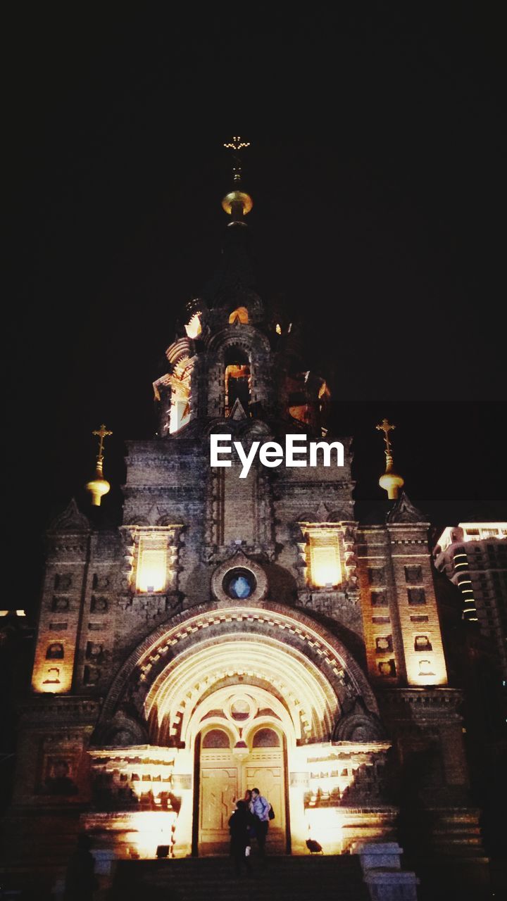 Low angle view of illuminated cathedral at night