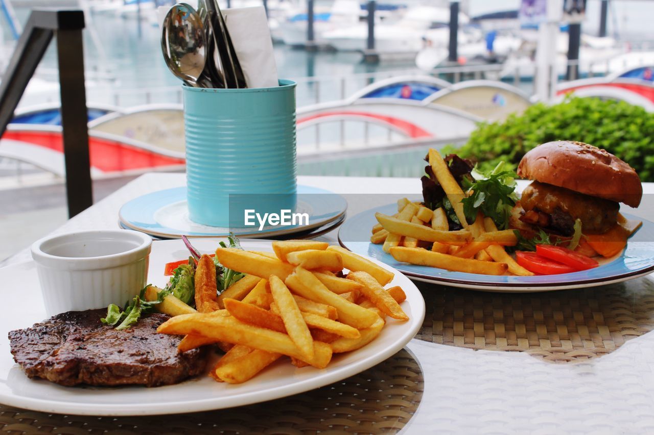 Close-up of fries with burger