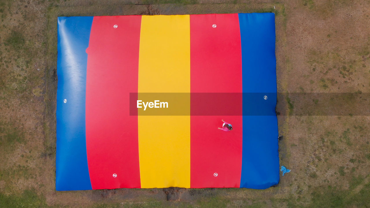 HIGH ANGLE VIEW OF MULTI COLORED PENCILS ON WALL