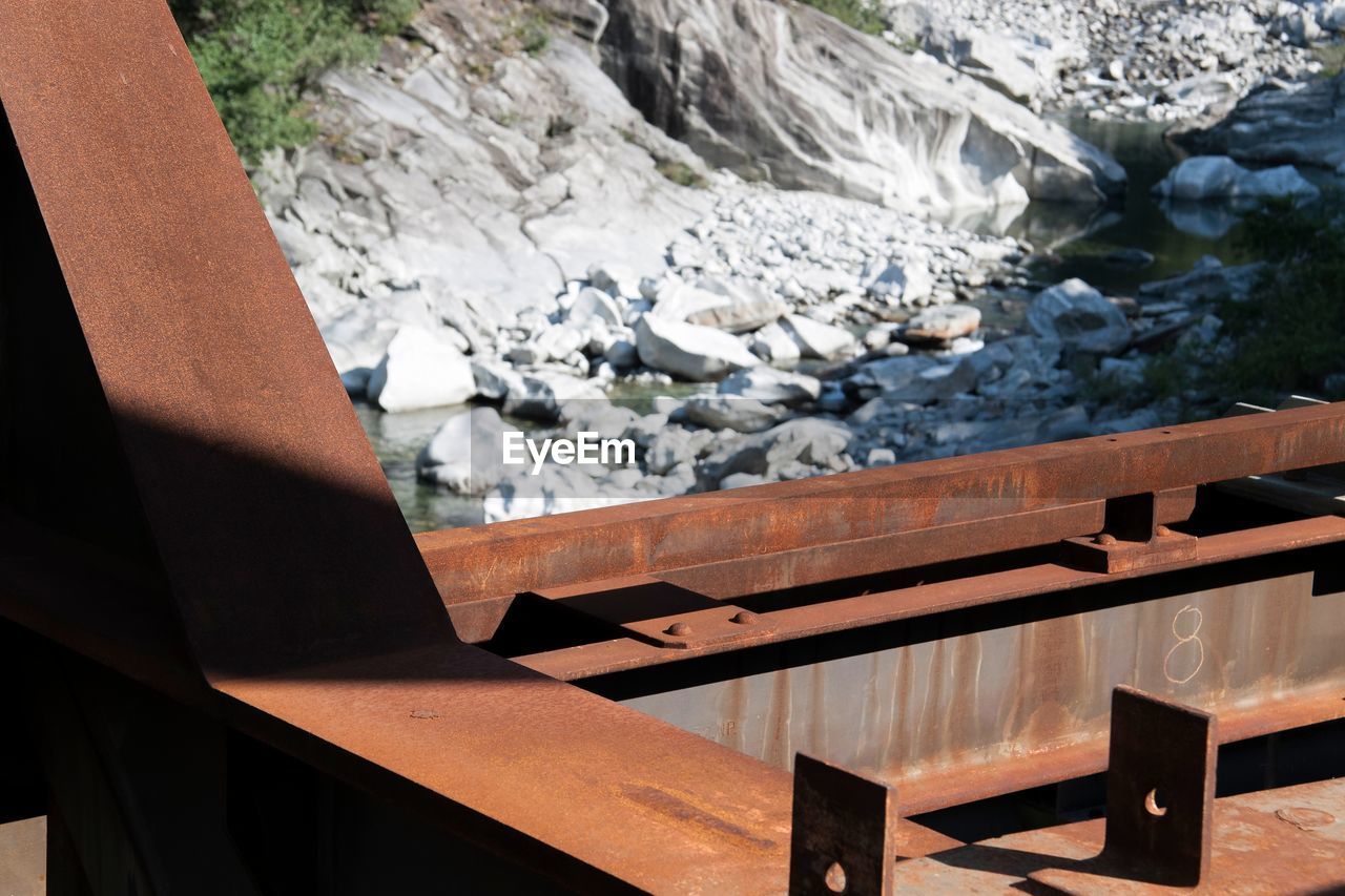 Close-up of wood against mountains