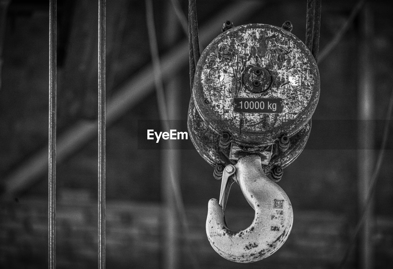 Close-up of chain hanging on rope