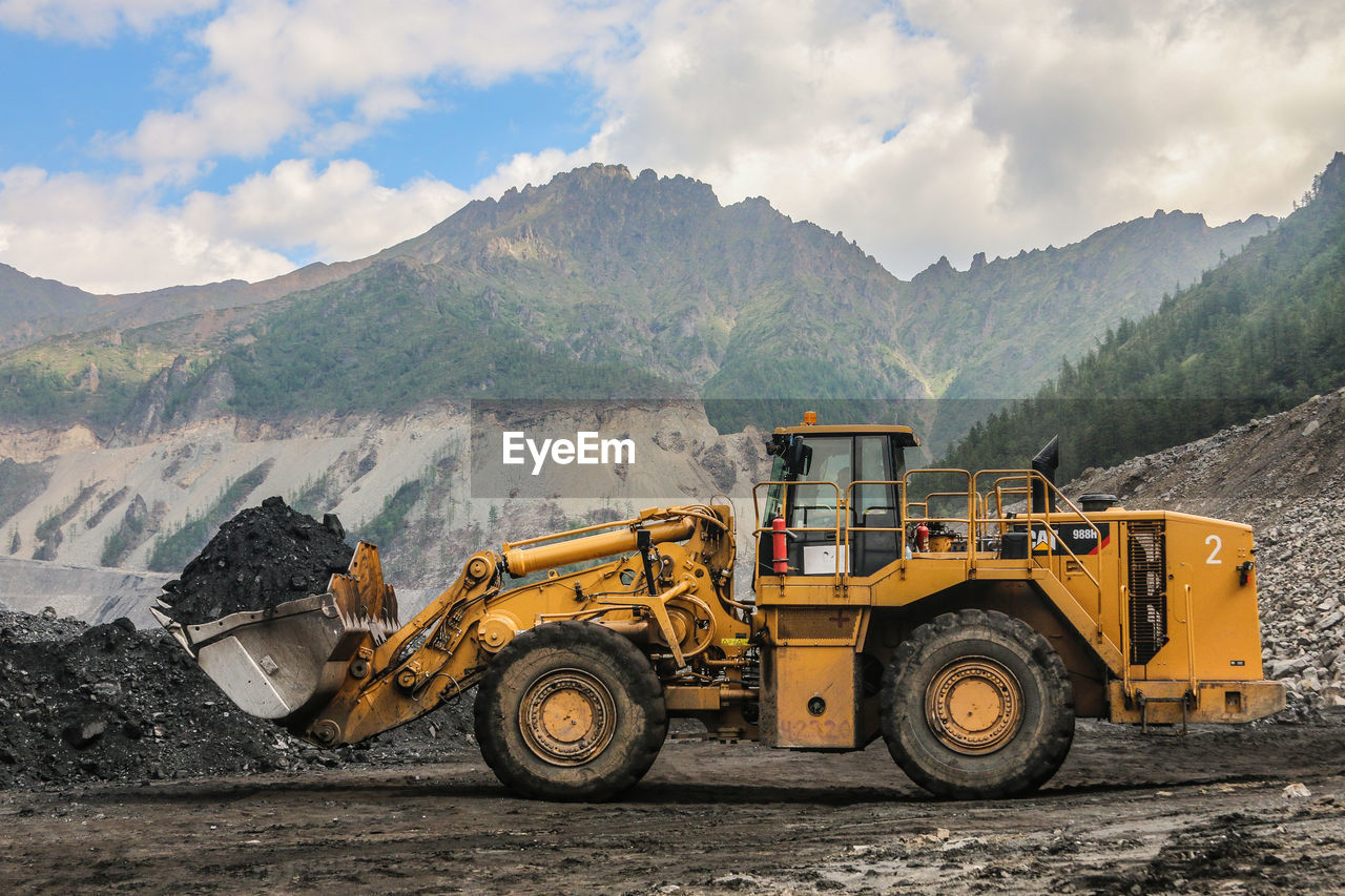 VIEW OF CONSTRUCTION SITE AGAINST MOUNTAIN RANGE