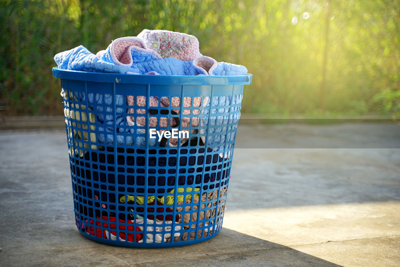 CLOSE-UP OF BASKET ON TABLE