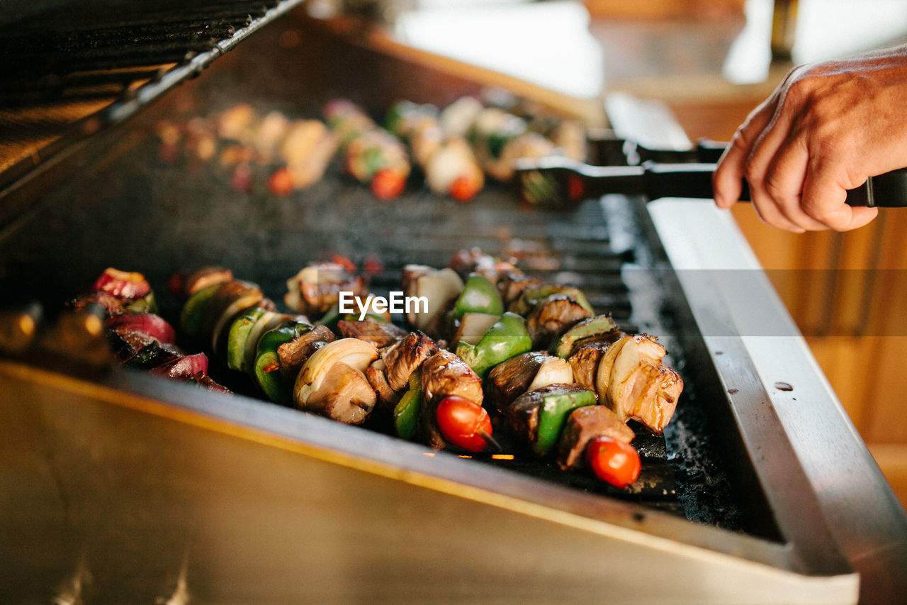 Cropped image of hand preparing food