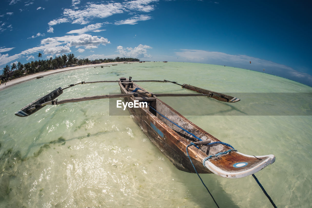 HIGH ANGLE VIEW OF NAUTICAL VESSEL ON SEA AGAINST SKY