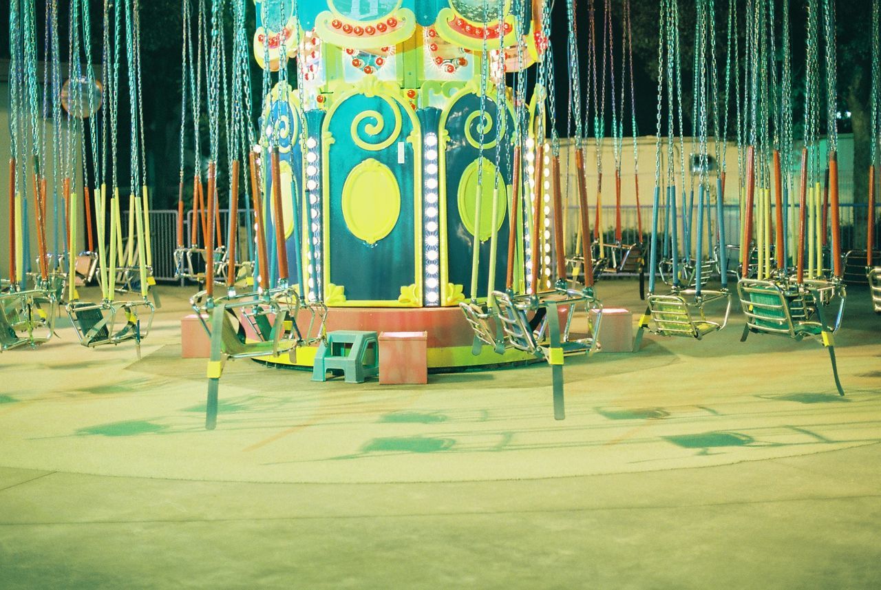 View of empty cropped swing ride