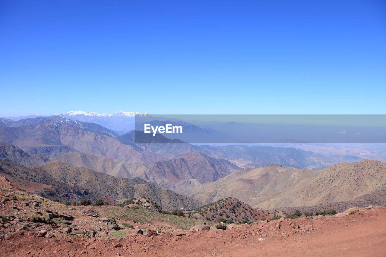 Landscape with mountain range in background