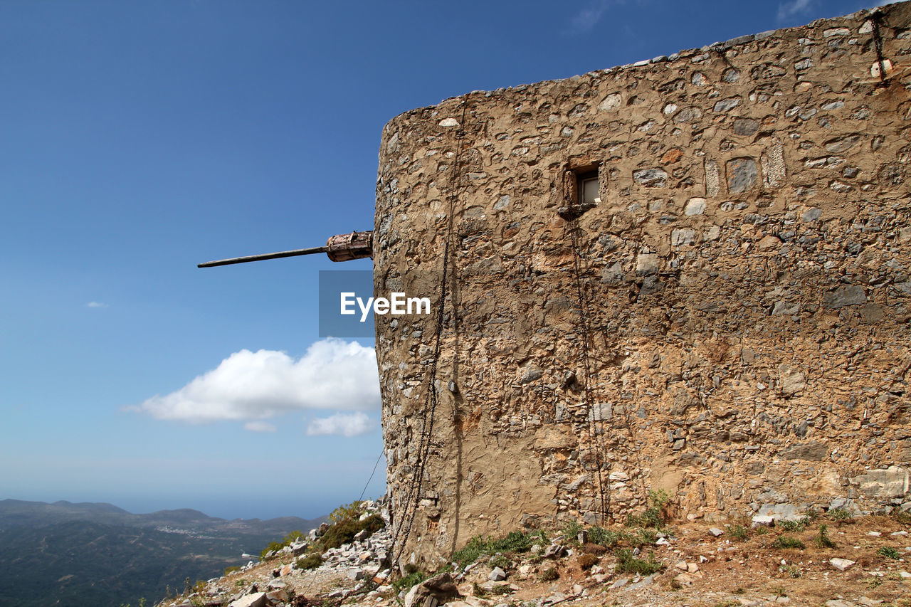 Ruins of ancient venetian windmills built in 15th century, lassithi plateau, crete, greece