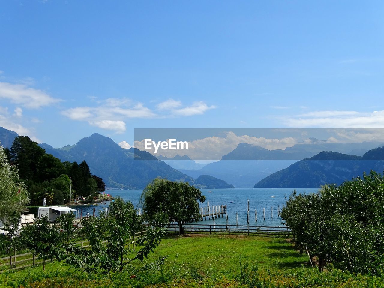 Scenic view of lake and mountains against sky