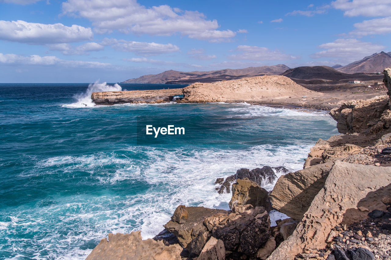 SCENIC VIEW OF SEA AND ROCKS