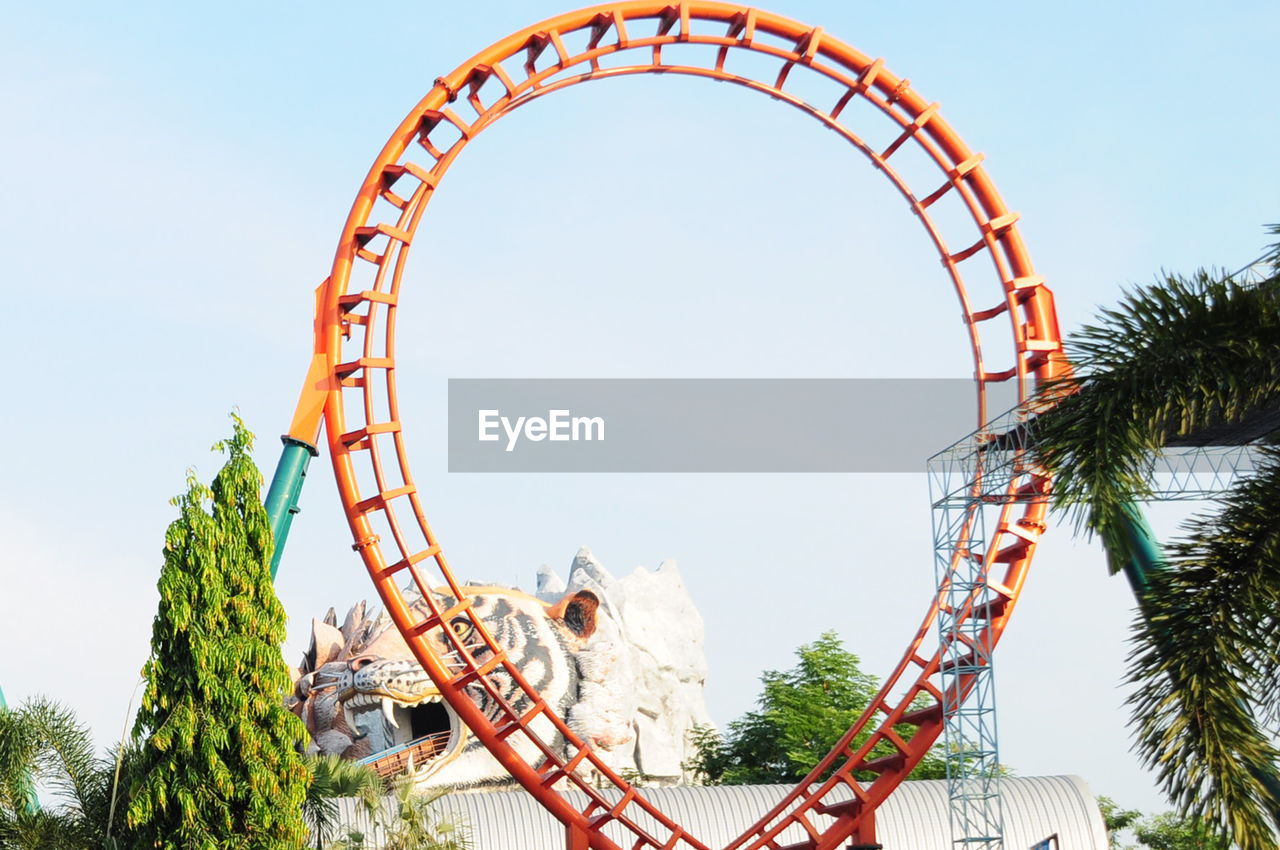 Low angle view of rollercoaster against sky