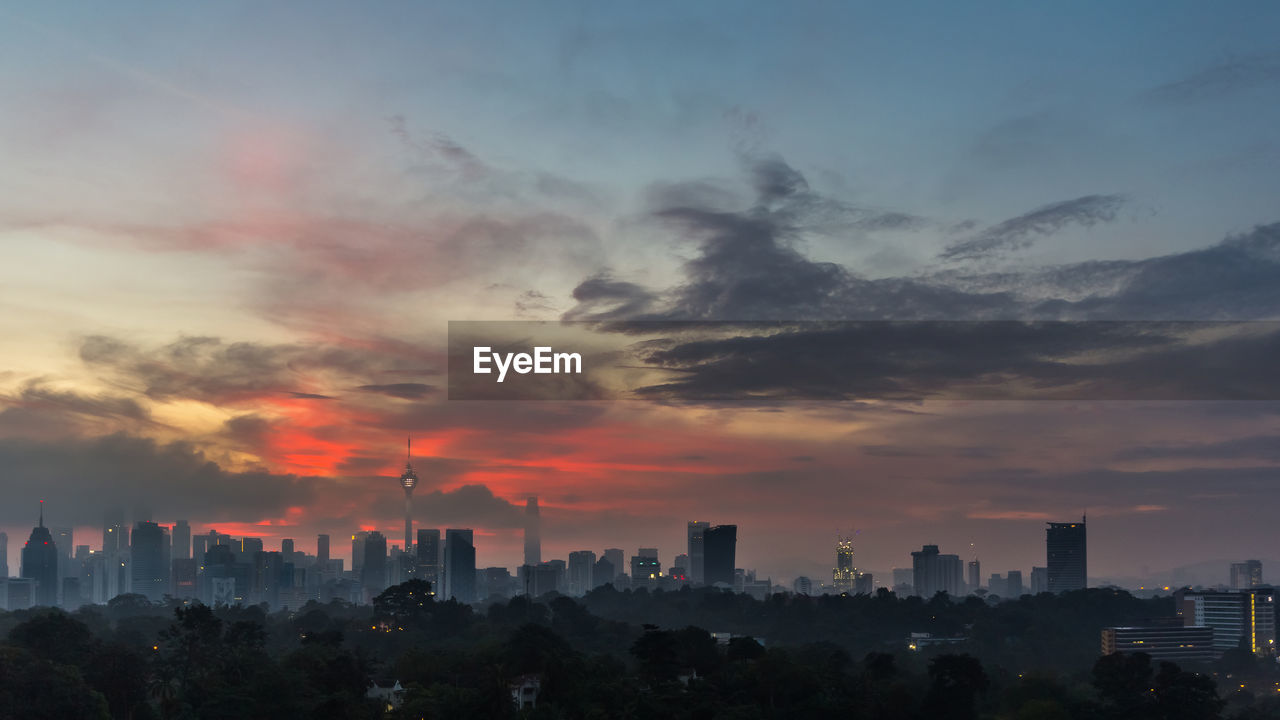 CITYSCAPE AGAINST SKY DURING SUNSET