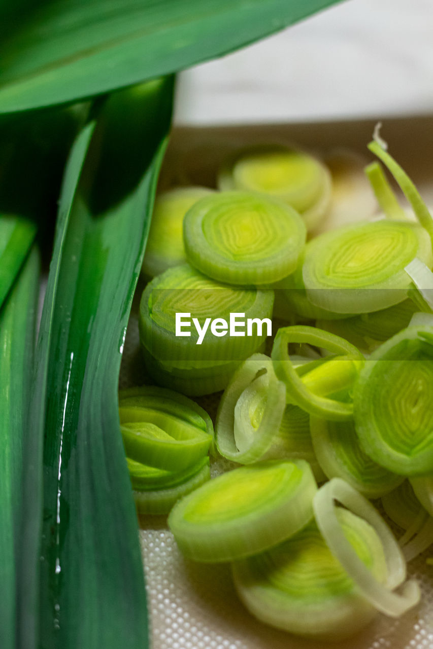 green, food, food and drink, plant, freshness, healthy eating, vegetable, wellbeing, produce, flower, no people, yellow, close-up, indoors, leek, still life, slice, leaf, fruit, organic