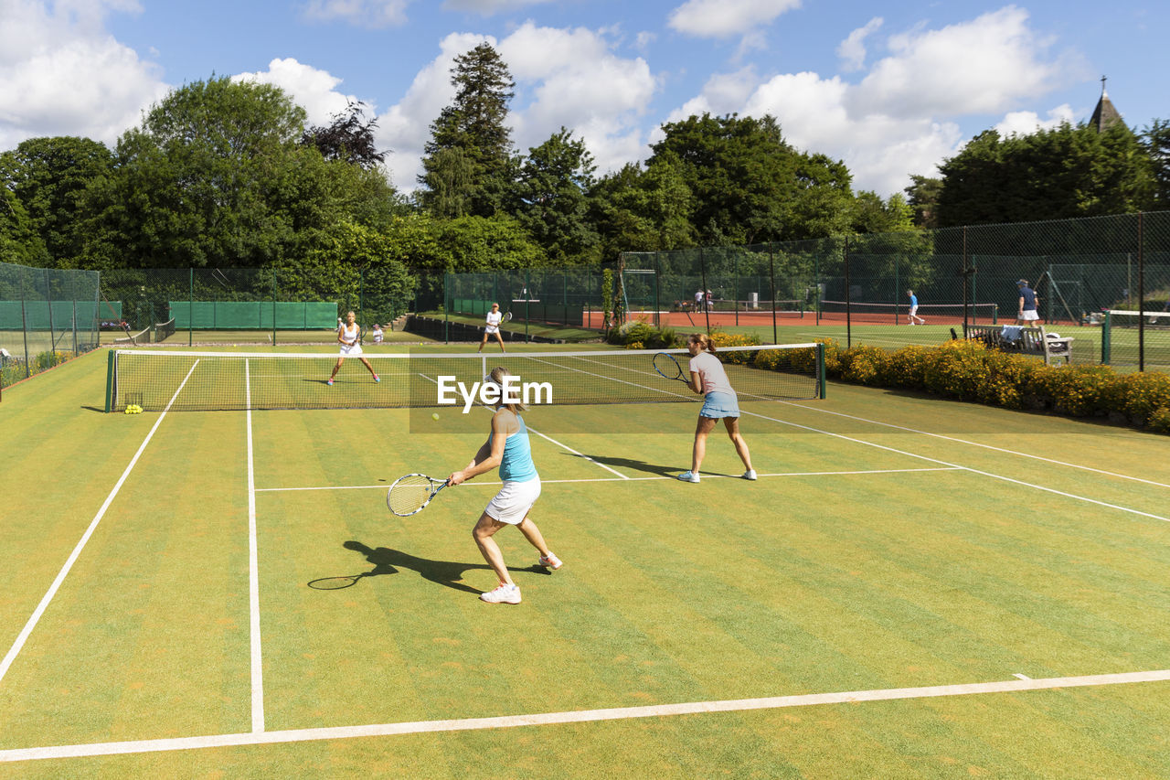 Mature women during a tennis match on grass court