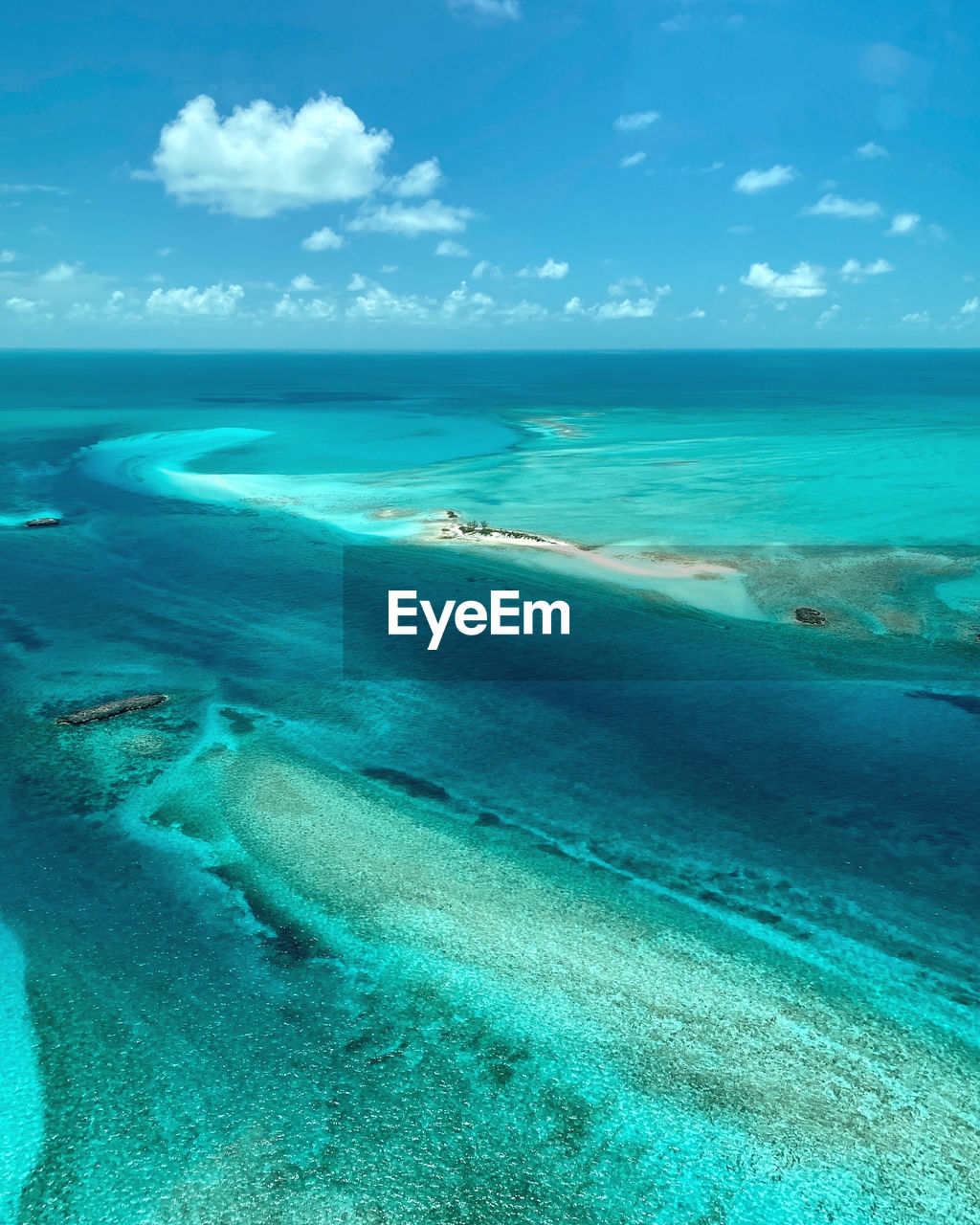 SCENIC VIEW OF BEACH AGAINST BLUE SKY