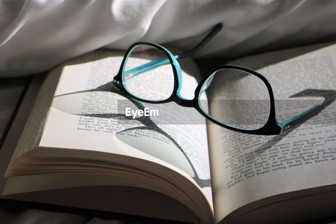 eyeglasses, glasses, vision care, publication, book, eyewear, education, no people, indoors, still life, paper, close-up, open, page, learning, reading, wisdom, communication