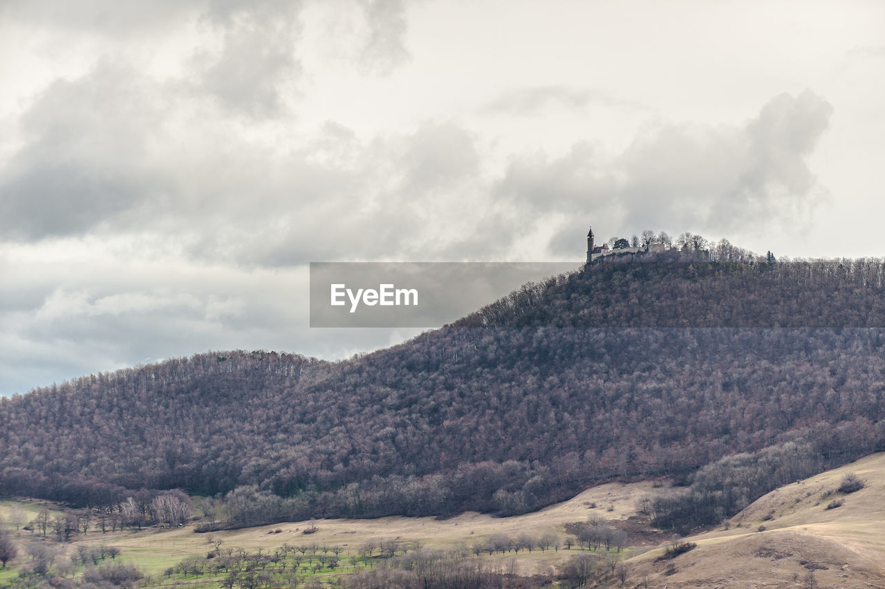 SCENIC VIEW OF MOUNTAIN AGAINST SKY