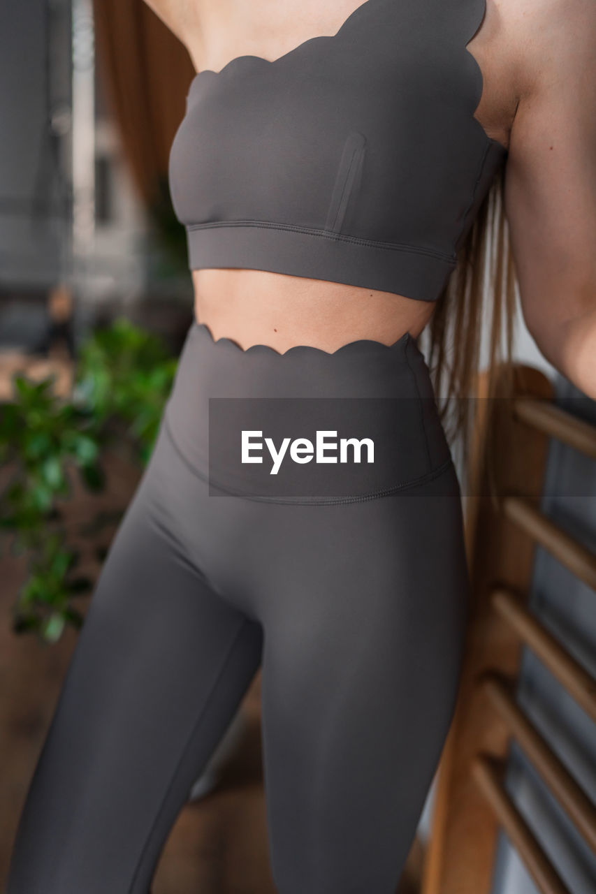 midsection of woman exercising at park