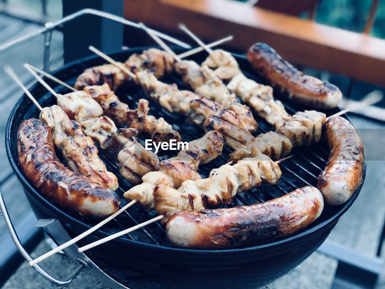 High angle view of meat in barbecue grill