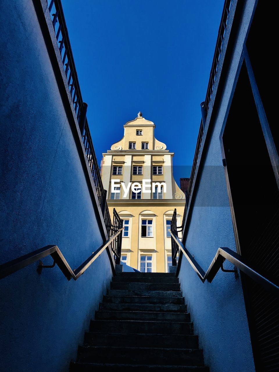 Low angle view of staircase against buildings