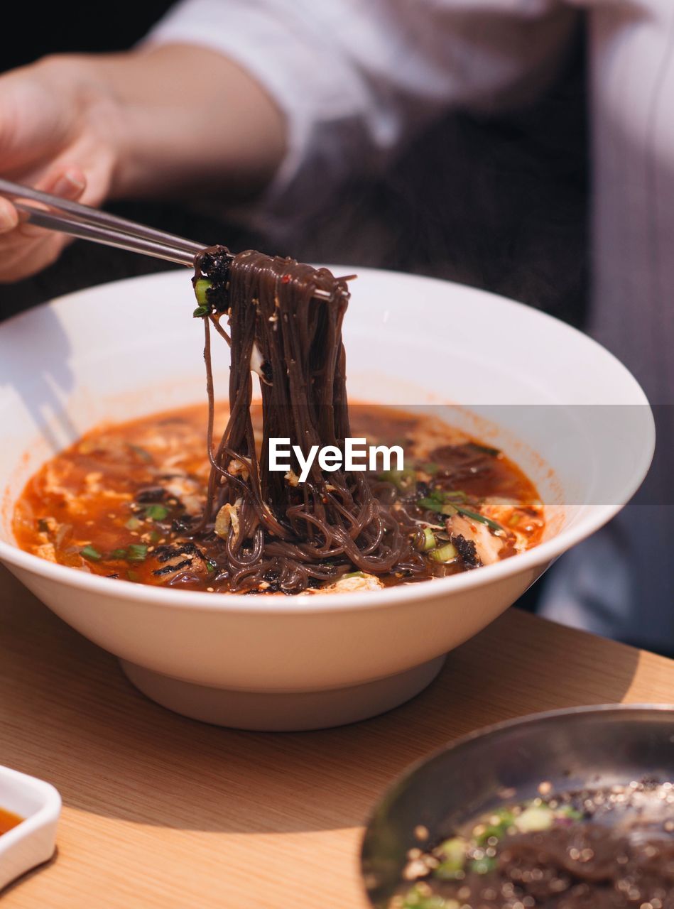 Close-up of man preparing food