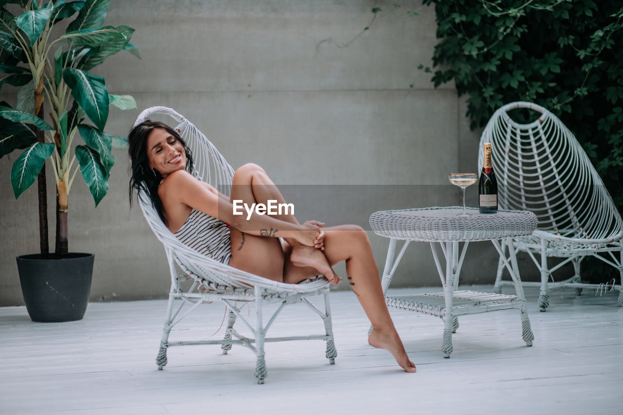 Woman sitting on chair at table