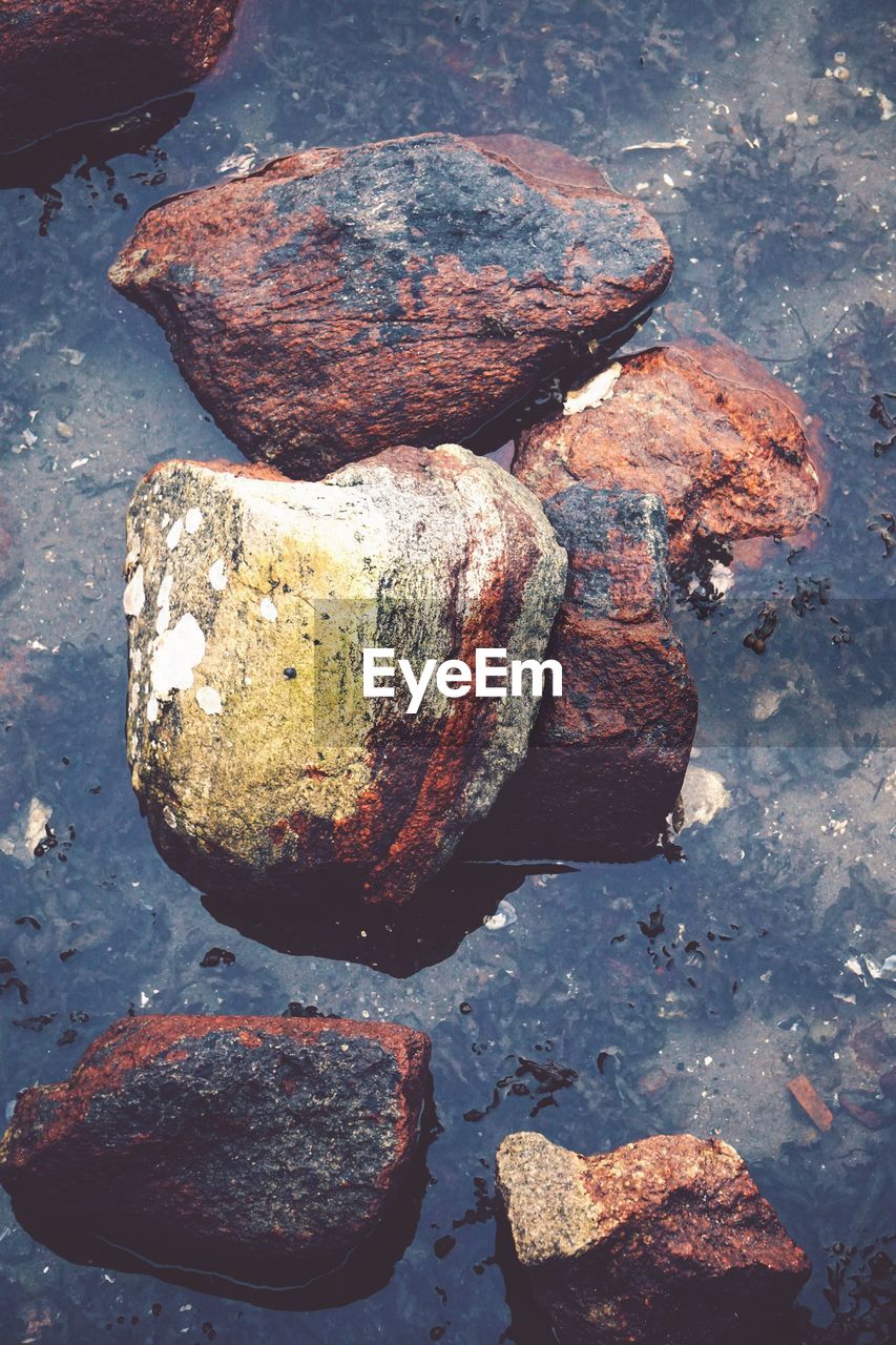 High angle view of stones on rock