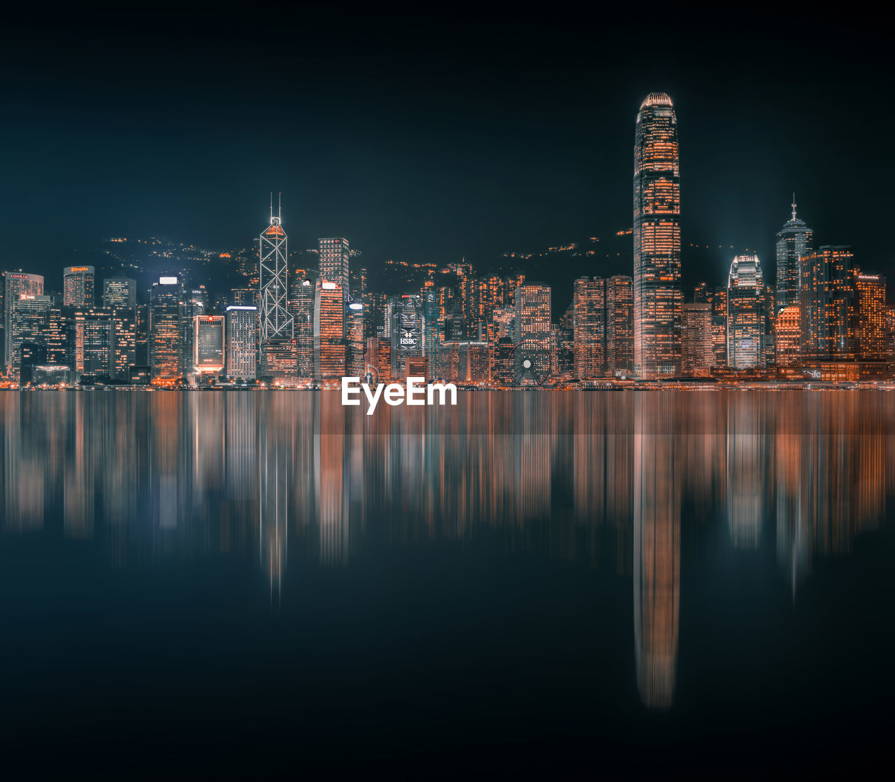 Reflection of illuminated buildings in city at night