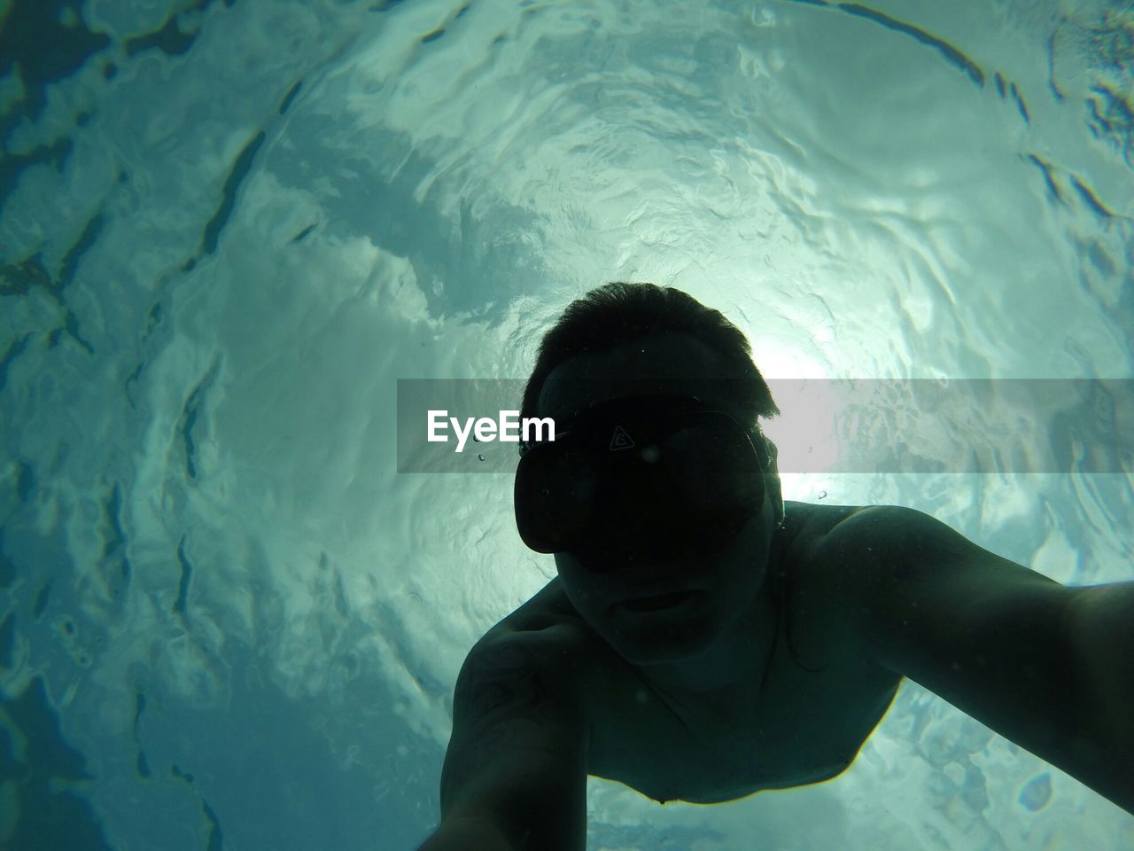 Self portrait of man free diving undersea